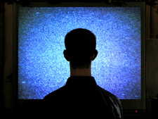 man-watching-tv-in-dark